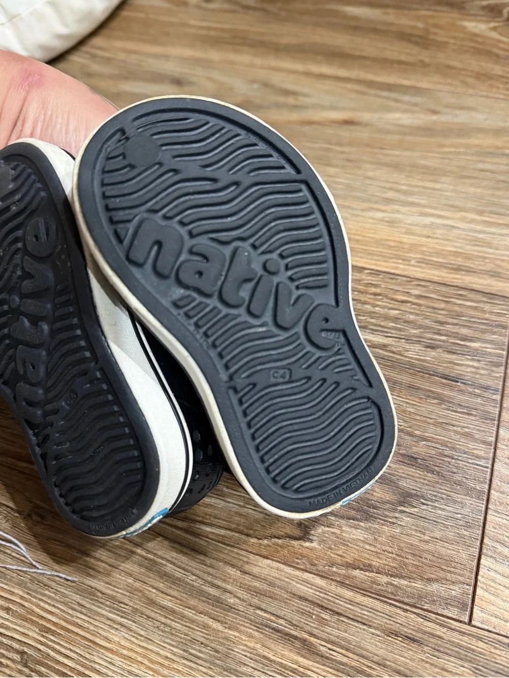 Native Shoes Black Slip-On Water Shoes with White Star Accents